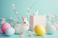 Serene Easter postcard with white bunny pastel eggs, delicate spring blossoms on soft blue background. Holiday greetings