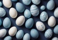A serene Easter background featuring delicately painted eggs with a white and blue palette, ideal for festive holiday designs