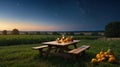 Autumn Evening Gathering: Pumpkins, Candles, and Stars on a Picnic Table Royalty Free Stock Photo