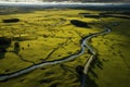 A serene and expansive field with a river gracefully meandering through its midst., Road in the countryside of Waikato, aerial