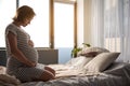 Serene expectant mother feeling her baby in stomach Royalty Free Stock Photo