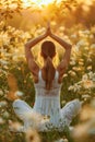 Serene female yoga practitioner in tree pose at sunset in peaceful field environment