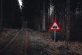 a serene forest scene with a train warning sign standing out against the natural backdrop Royalty Free Stock Photo