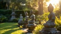 A serene garden filled with statues and monuments their shadows lengthening in the backlight