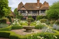 serene garden with fountain and blooming roses in the background of tudor house