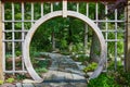 Serene Garden with Wooden Archway and Flagstone Path in Elkhart