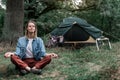 Serene girl enjoying meditation in the woods Royalty Free Stock Photo