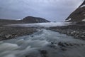 Serene glacier with river arising underneath, Sarek national park, Sweden