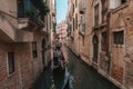 Serene Gondola Ride Through Charming Venetian Canals - Iconic Waterway Scene Royalty Free Stock Photo