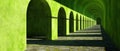 Serene Green Archway Corridor Architectural Perspective Lush Greenery Stone Path Royalty Free Stock Photo