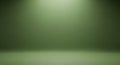 Serene Green Studio Backdrop with Dramatic Spotlight Effect Royalty Free Stock Photo