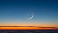 Crescent moon and venus conjunction above clouds at sunset Royalty Free Stock Photo
