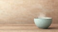 Warm Steam Rising from a Light Blue Bowl on a Rustic Wooden Surface with Soft Background Royalty Free Stock Photo
