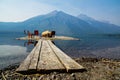 Serene lake dock with mountain backdrop in Glacier National Park.