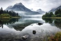 serene lake surrounded by misty mountains and towering peaks Royalty Free Stock Photo