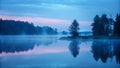 Serene lakeside landscape at dawn with mist and reflections in water Royalty Free Stock Photo