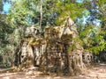 The serene landscape of the Cambodian forest dotted with the remnants of ancient medieval ruins