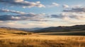 Expansive Landscapes: A Captivating Photo Of A Grassy Field With Hills