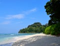 White Sandy Beach, Calm Sea Waters, Greenery and Blue Sky - Neil`s Cove, Radhanagar Beach, Havelock Island, Andaman Nicobar, India Royalty Free Stock Photo