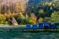 A serene landscape somewhere in the forest, a clearing in a rural area with a haystack and several beehives placed in the wild so Royalty Free Stock Photo