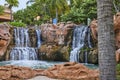 Serene Man-Made Waterfall in Lush Tropical Oasis