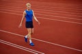 Serene moment as a jogger readies for the sprint. Young athlete man, professional sportsman warming-up before Royalty Free Stock Photo