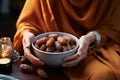 A serene moment as a Muslim woman holds a bowl of dates to break her fast