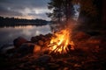 A serene moment captured as a campfire flickers on the lakes edge, creating a mesmerizing reflection, View of campfire burning by