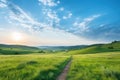 Serene Morning Walk on a Winding Path through a Green Hillside Royalty Free Stock Photo