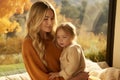Serene mother cultivates a heartfelt bond with her beloved daughter nurturing harmonious connection