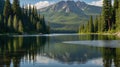 Scenic Lake View with Evergreen Forest and Mountain Peaks Reflection Royalty Free Stock Photo