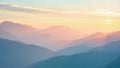 Serene mountain range silhouettes at sunrise or sunset with soft hues Royalty Free Stock Photo