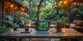 Cozy outdoor workspace with laptop on wooden table, surrounded by string lights for productivity Royalty Free Stock Photo