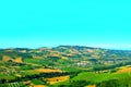 Overview from Carassai at a Marche hilly landscape with trees and fields