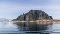 A serene panorama of the rugged Lofoten Islands in Norway, where jagged peaks pierce the sky Royalty Free Stock Photo