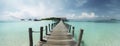 Serene Panorama: Wooden Pier Leading to a Thatched-Roof Hut Over Turquoise Ocean, ai generative