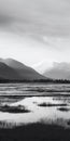 Simplistic Black And White Landscape: Mountain Range And Lake
