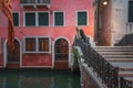 Serene Pink Building by Canal in Venice, Italy - Old-World Charm and Modern Sophistication