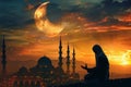 Serene Ramadan Evening Prayer Against a Breathtaking Crescent Moon Royalty Free Stock Photo