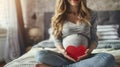 The Serene Reflections of a Young Pregnant Mother Cradling a Red Heart While Seated on Her Bed