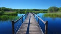 A serene setting as the wooden footbridge stretches over the glasslike surface of the pond perfectly reflecting the Royalty Free Stock Photo