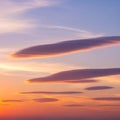 A serene sky features lenticular clouds Royalty Free Stock Photo