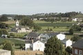 A Serene Snapshot: Small Town Nestled Amidst Verdant Farmland and Majestic Church Royalty Free Stock Photo