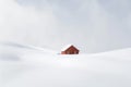 Snowy winter landscape with a wooden house in the middle of it