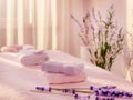 Serene spa environment with soft pink towels, candles and exotic flowers Royalty Free Stock Photo