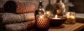 Serene Spa Retreat: Tranquil Setting with Ambient Candles and Warm Towels Royalty Free Stock Photo