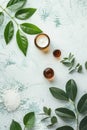 A serene spa setup with a creamy white open jar