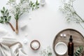 A serene spa setup with a creamy white open jar