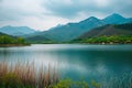 Serene Spring: Mountain Lake Majesty. Royalty Free Stock Photo