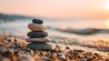 Serene stack of stones on a beach at sunset Royalty Free Stock Photo